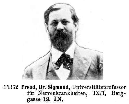 Freud Portraitfoto mit Anzug. Text darunter: "14362 Freud, Dr. Sigmund, Universitätsprofessor für Nervenkrankheiten, IX/1, Berggasse 19. IN."