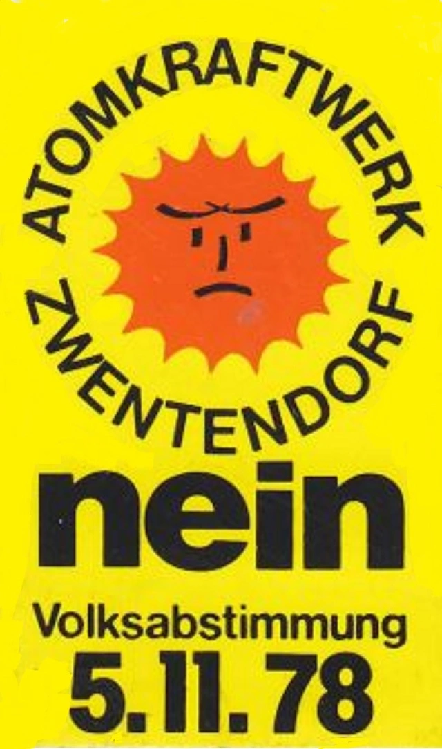 Gelbes Plakat mit einer ernsten orangen Sonne in der Mitte: "Atomkraftwerk Zwentendorf nein. Volksabstimmung 5.11.78"