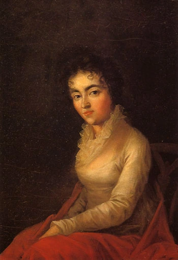 Portrait der seitlich sitzenden Constanze Weber, die den Maler direkt mit dunklen Augen anblickt. Schwarze Locken hängen ihr in die Stirn und die Hände liegen auf ihrem Schoß.